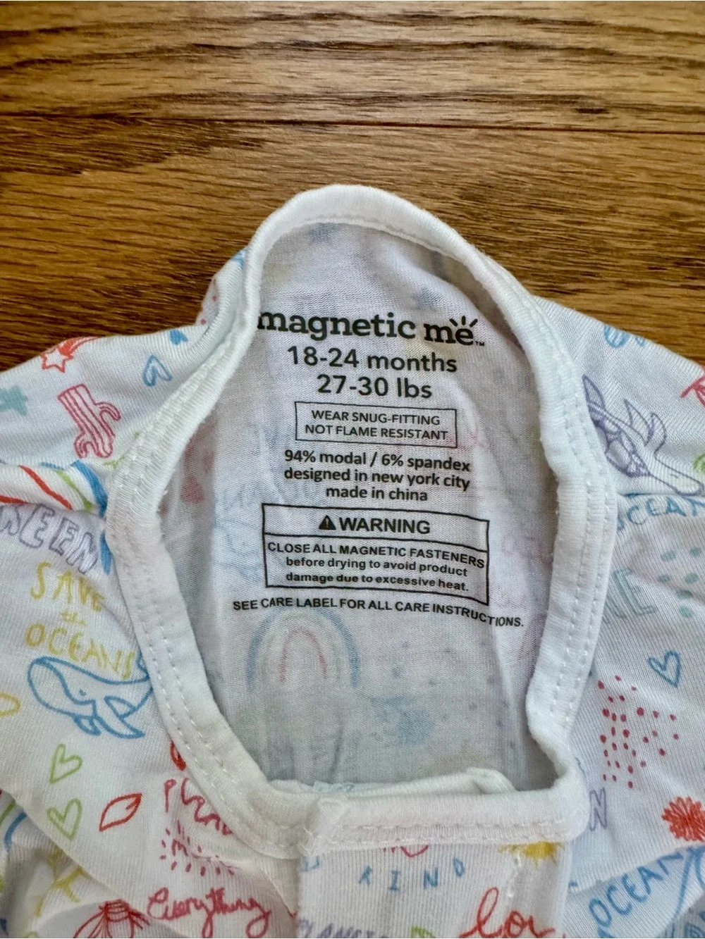 Magnetic Me White Footed One-Piece with Pastel Rainbow Print